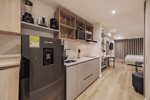 Fridge, microwave, stovetop, coffee/tea maker