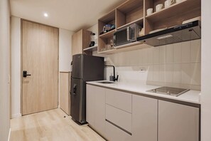 Fridge, microwave, stovetop, coffee/tea maker