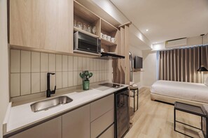 Microwave, stovetop, coffee/tea maker, cookware/dishes/utensils