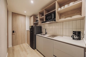 Fridge, microwave, stovetop, coffee/tea maker