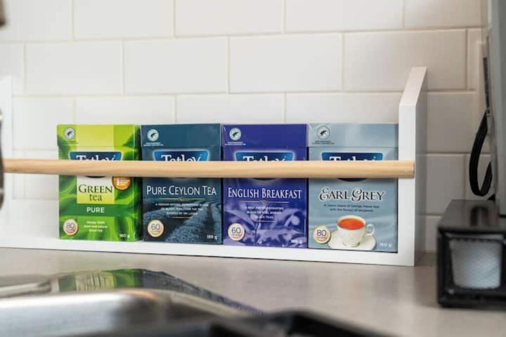 A tea display with various brands and types of tea.