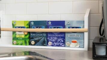 A tea display with various brands and types of tea.