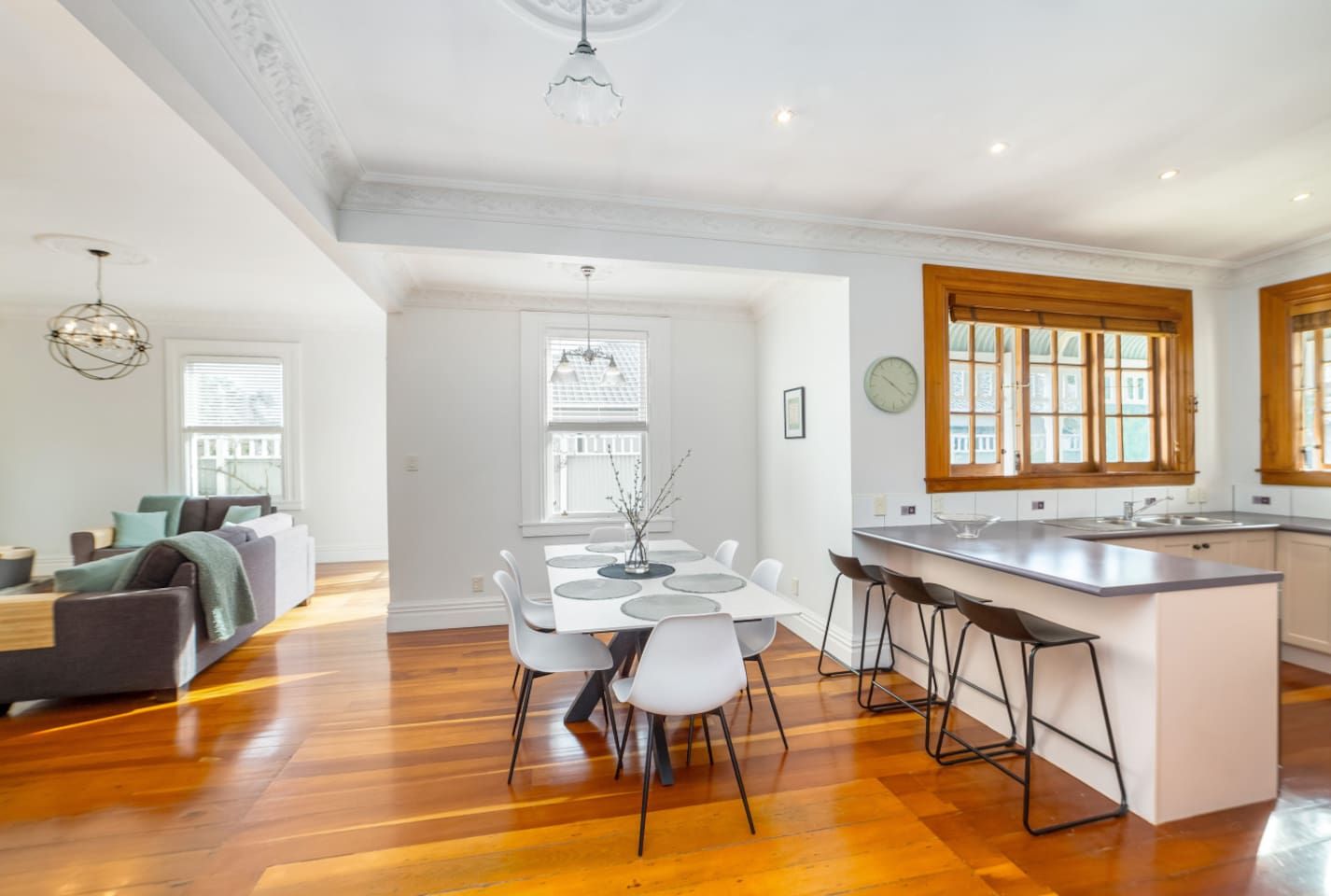 A spacious living room with a dining area and kitchen.