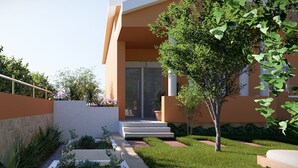 A modern building with a flat roof, large windows, and a well-maintained garden with a pathway leading to the entrance. - Luna Serene Garden House | Jacuzzi (Zadar)