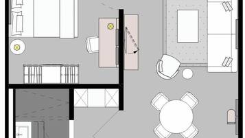 Pianta di un albergo con zona pranzo, soggiorno, cucina e bagno.