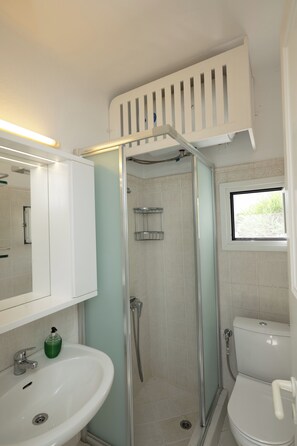 Shower, hair dryer, towels, toilet paper