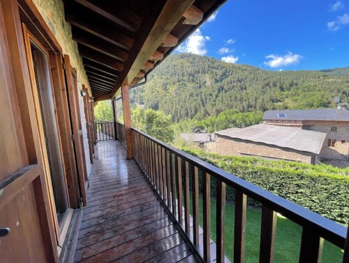 House in the middle of nature surrounded by mountains