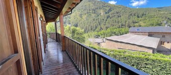 House in the middle of nature surrounded by mountains