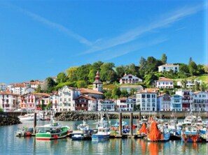 A harbor with colorful buildings and boats.
