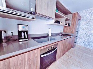 Fridge, microwave, stovetop, coffee/tea maker