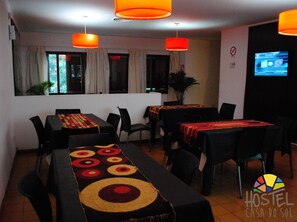 Enjoy meals together at the communal table, surrounded by comfortable seating and natural light.