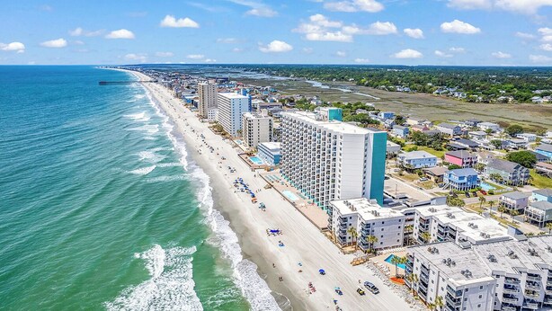 A coastal hotel with multiple floors, a beachside location, and a view of the ocean. - Seagull Heights! 2-BR 2-BA OCEANFRONT Royal Garden Resort Condo In&Outdoor Pools (Murrells Inlet)