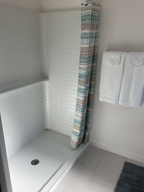 Shower, towels, soap, toilet paper