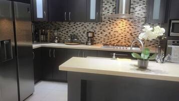 Fridge, microwave, stovetop, coffee/tea maker