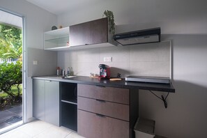 Comfort Apartment, Pool View | Private kitchen | Highchair, dining tables