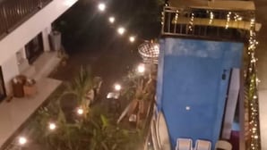 A rooftop pool area with two swimming pools, lounge chairs, and string lights. - Ceria House Ungasan Uluwatu  (Ungasan)