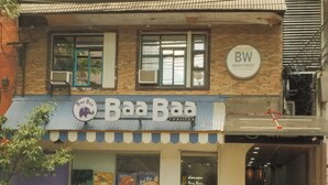 A two-story building with a Thai tea shop named 'Baa Baa' on the ground floor. - Brightwood Hotel & Residences (Manila)