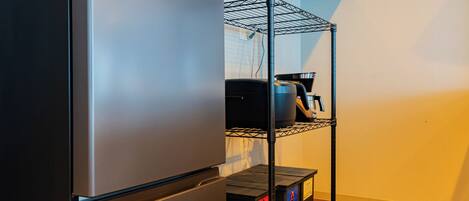 Full-size fridge, microwave, stovetop, toaster