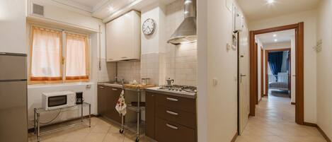 Fridge, microwave, cookware/dishes/utensils