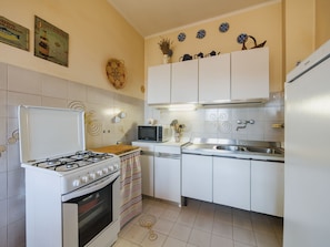 Fridge, microwave, cookware/dishes/utensils