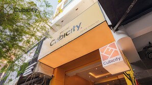 The exterior of Cubicity Hotel, including the entrance and signage. - Cubicity De Tham (Ho Chi Minh City)