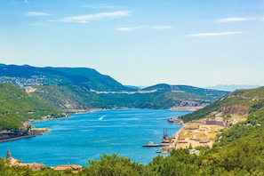 A coastal town with a river, hills, and a small harbor with boats. - Villa Natali With Pool And Sea View (Kraljevica)