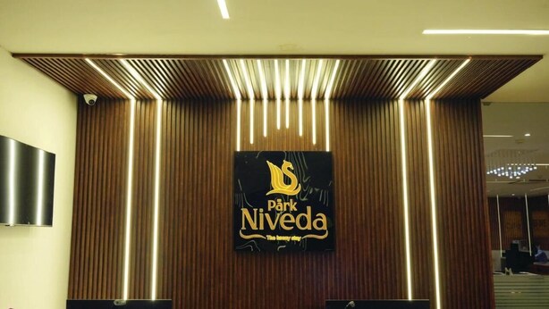 A reception desk with a sign that reads "Park Niveda." - Park Niveda (Vijayawada)