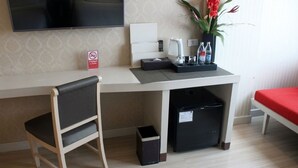 A hotel room with a desk, chair, TV, and a bed with a red cover. - Vwish Hotel Khon Kaen (Khon Kaen)