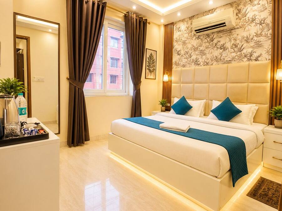 A modern hotel room with a bed, bedside tables, a ceiling fan, and a window with curtains.