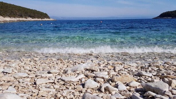 A pebble beach with clear water and distant hills. - House B - 45m From the Sea (Vela Luka)