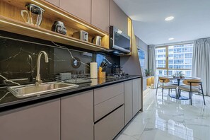 Fridge, microwave, stovetop, coffee/tea maker