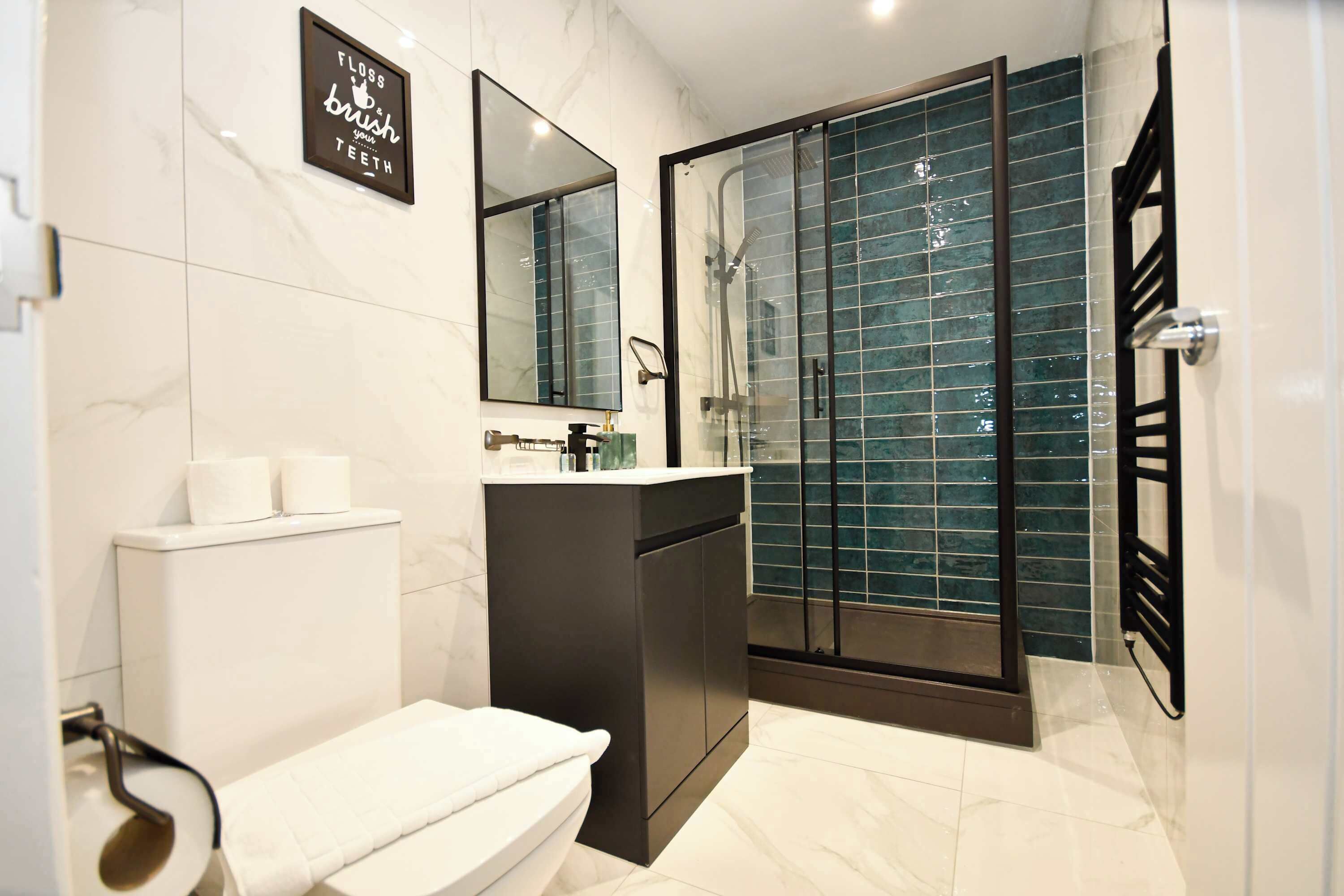 Shower, hair dryer, towels, shampoo