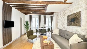 Comfort Apartment, City View | Living area | 80-cm Smart TV with digital channels