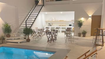 Outdoor pool, open 10:00 AM to 8:00 PM, pool loungers