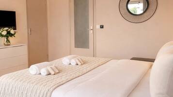 Comfort Studio, City View | Living area | 80-cm Smart TV with digital channels