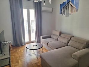 Luxury Apartment, Balcony, City View | Living area | 32-inch Smart TV with digital channels