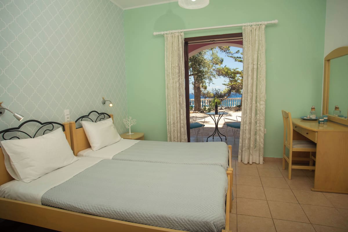 Basic Studio, 2 Twin Beds, Balcony, Sea View | 2 bedrooms, individually decorated, individually furnished