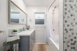 Shower, hair dryer, towels, shampoo