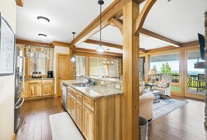 Dishwasher, coffee/tea maker, cookware/dishes/utensils, dining tables