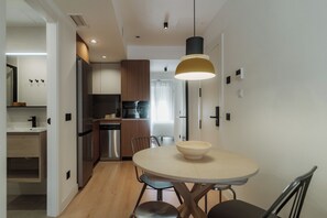 Apartment, 3 Bedrooms | Living area | 50-cm TV with cable channels