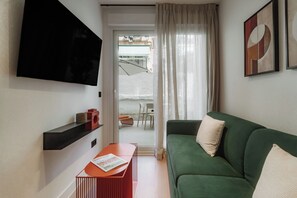 Apartment, 2 Bedrooms | Living area | 50-cm TV with cable channels