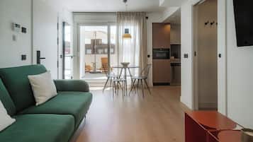 Apartment, 1 Bedroom | Living area | 50-cm TV with cable channels