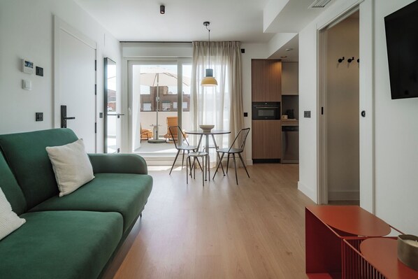Apartment, 1 Bedroom | Living area | 50-cm TV with cable channels