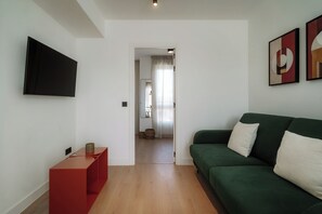 Apartment, 1 Bedroom | Living area | 50-cm TV with cable channels