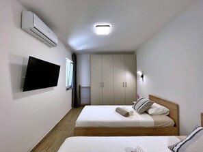 2 dormitorios, tabla de planchar con plancha, wifi y ropa de cama