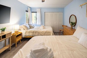 A bedroom with two beds, a desk, a chair, a wardrobe, and a mirror. - ‼️Calm Waterside Condo‼️ | Kayaks, Paddles, Pool (Mary Esther)