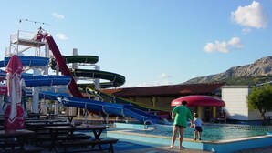 A water park with multiple slides and a swimming pool. - Charming Apartment Brnic No. 4 - with spacious Balcony (Baska)