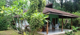 For 5 persons - 300 m from the beach in a tropical garden with biotope.