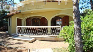 A building with the name "VILLA STEFANY" on the facade, featuring a balcony with a white railing and a paved entrance area. - Apartment Mrkus brdo - with Balcony, near the Beach (Baska)
