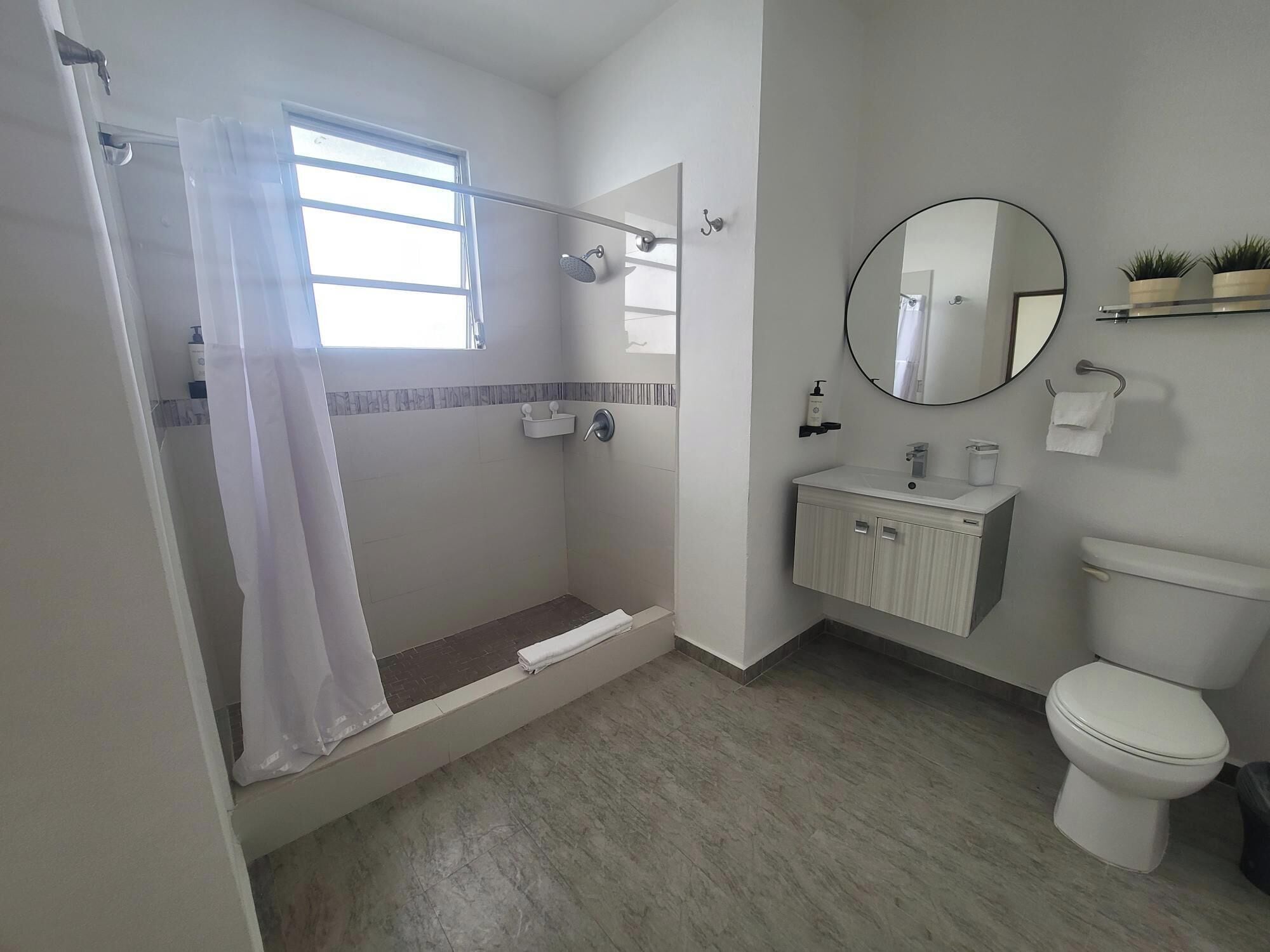 Apartment, 1 Queen Bed | Bathroom | Shower, hair dryer, towels, soap